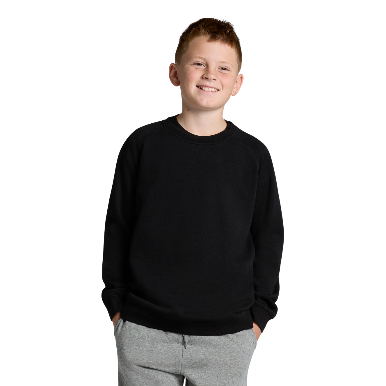 Front view of youth wearing grey AS Colour Youth Supply Sweatshirt smiling looking at the camera with hands in pockets