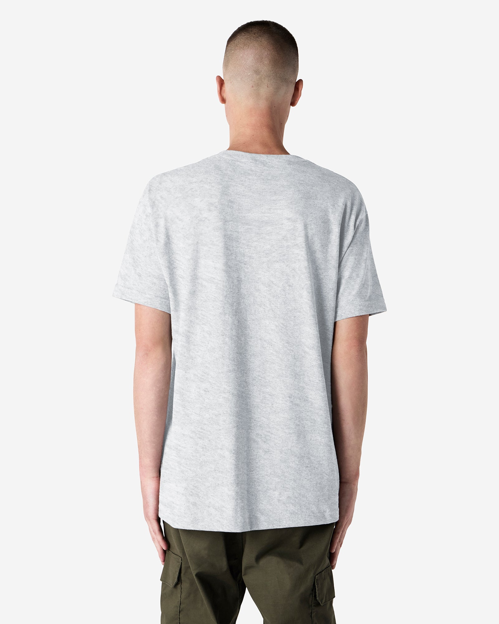 Back view of man wearing grey American Apparel Heavyweight Unisex T-Shirt with arms by side