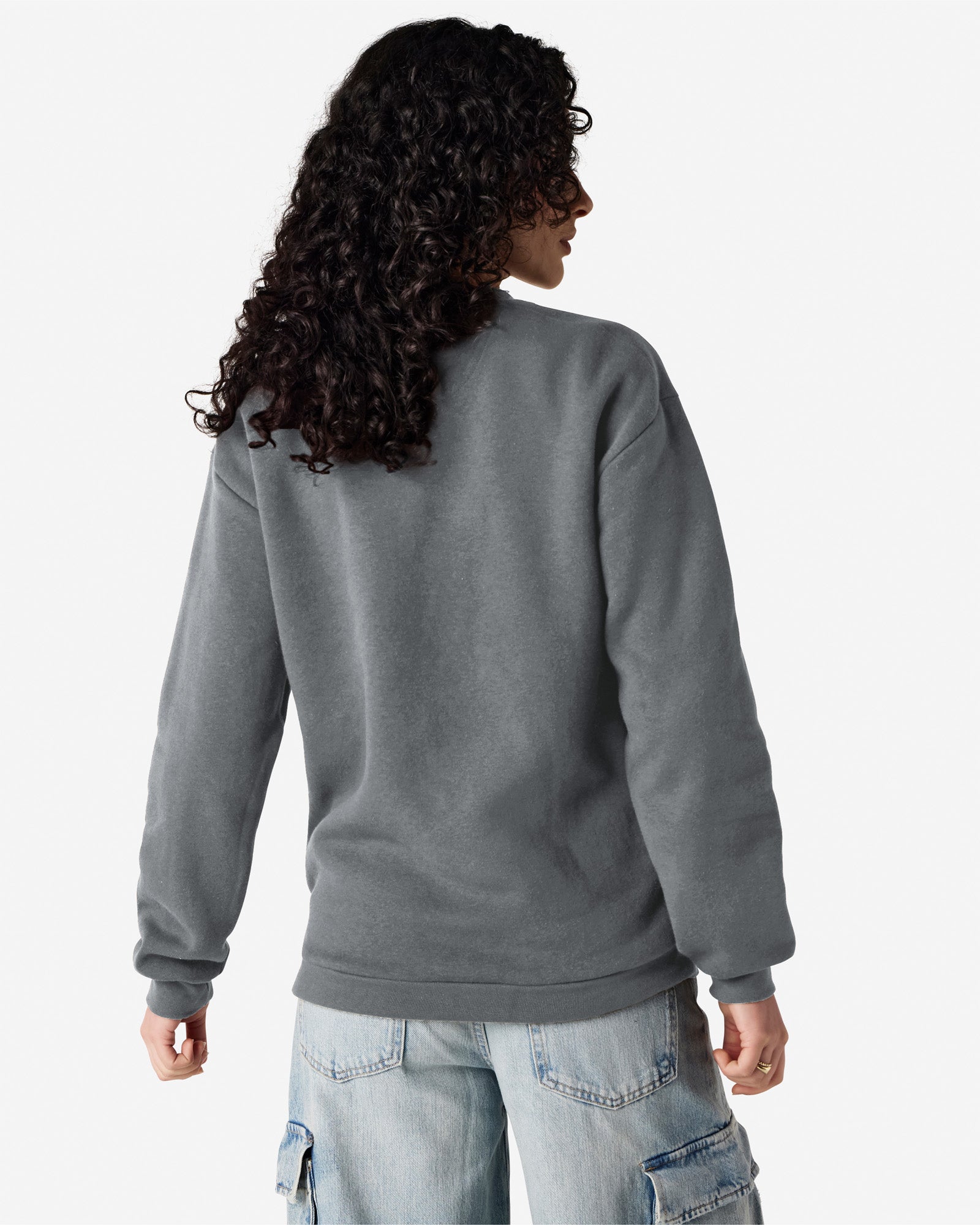 Back view of woman with black hair looking right wearing asphalt coloured American Apparel Crewneck Sweatshirt
