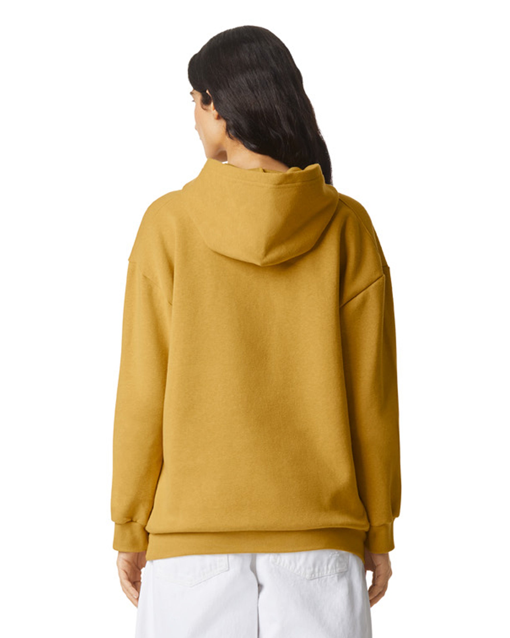 Back view of woman wearing mustard American Apparel RF498 Unisex Pullover Hoodie looking to the left