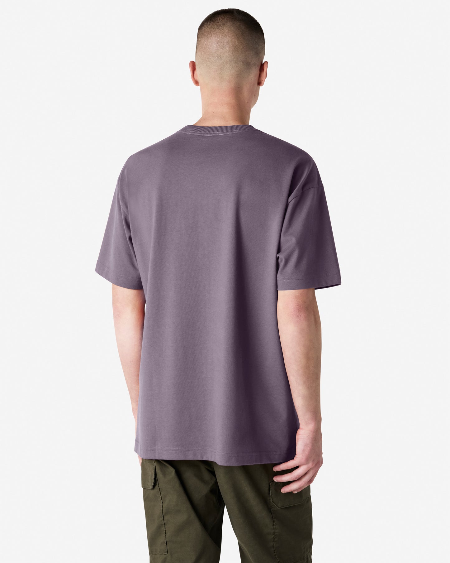 Back view of man wearing violet coloured American Apparel Super Heavyweight T-Shirt with arms by side