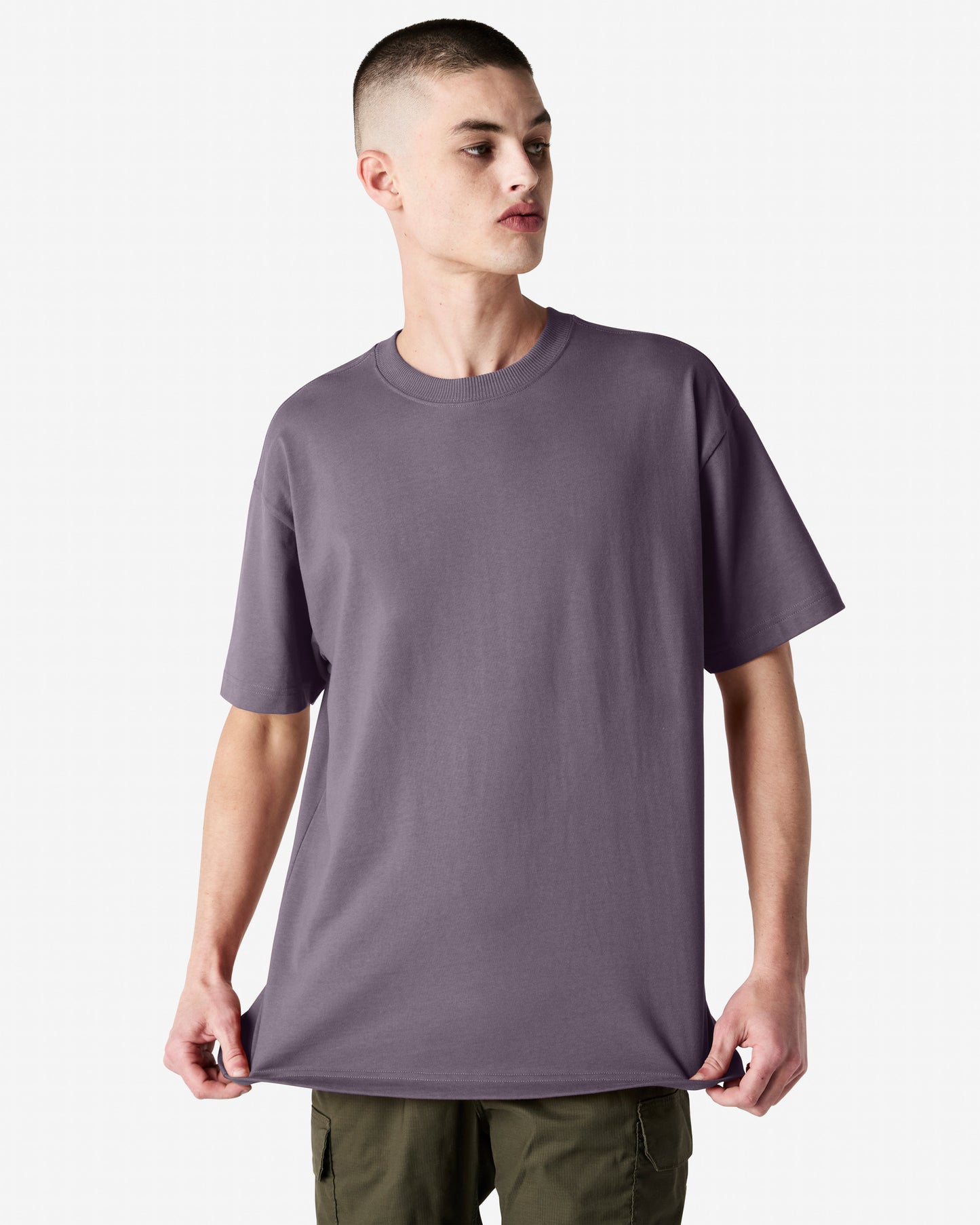 Front view of man wearing violet coloured American Apparel Super Heavyweight T-Shirt looking to the left