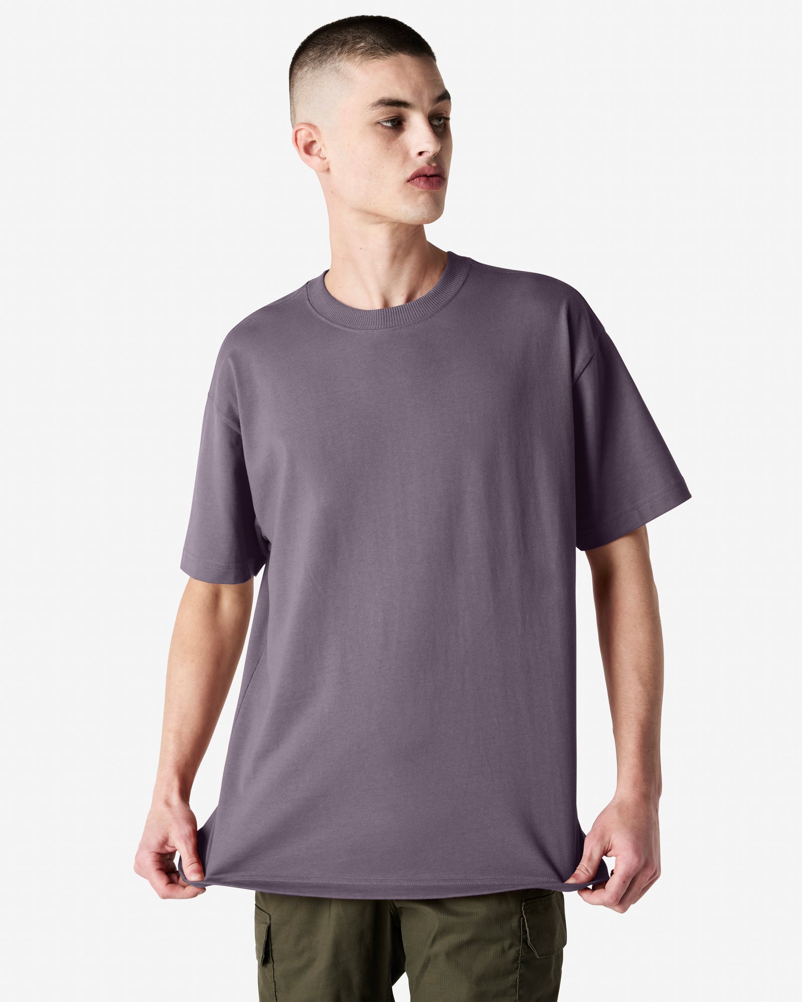 Front view of man wearing violet coloured American Apparel Super Heavyweight T-Shirt looking to the left