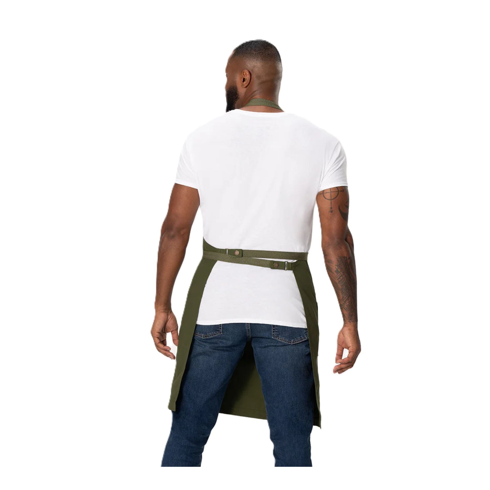 Back view of a man wearing the Chef Works Eco-Friendly Bib Apron with Pockets showing strap configuration.