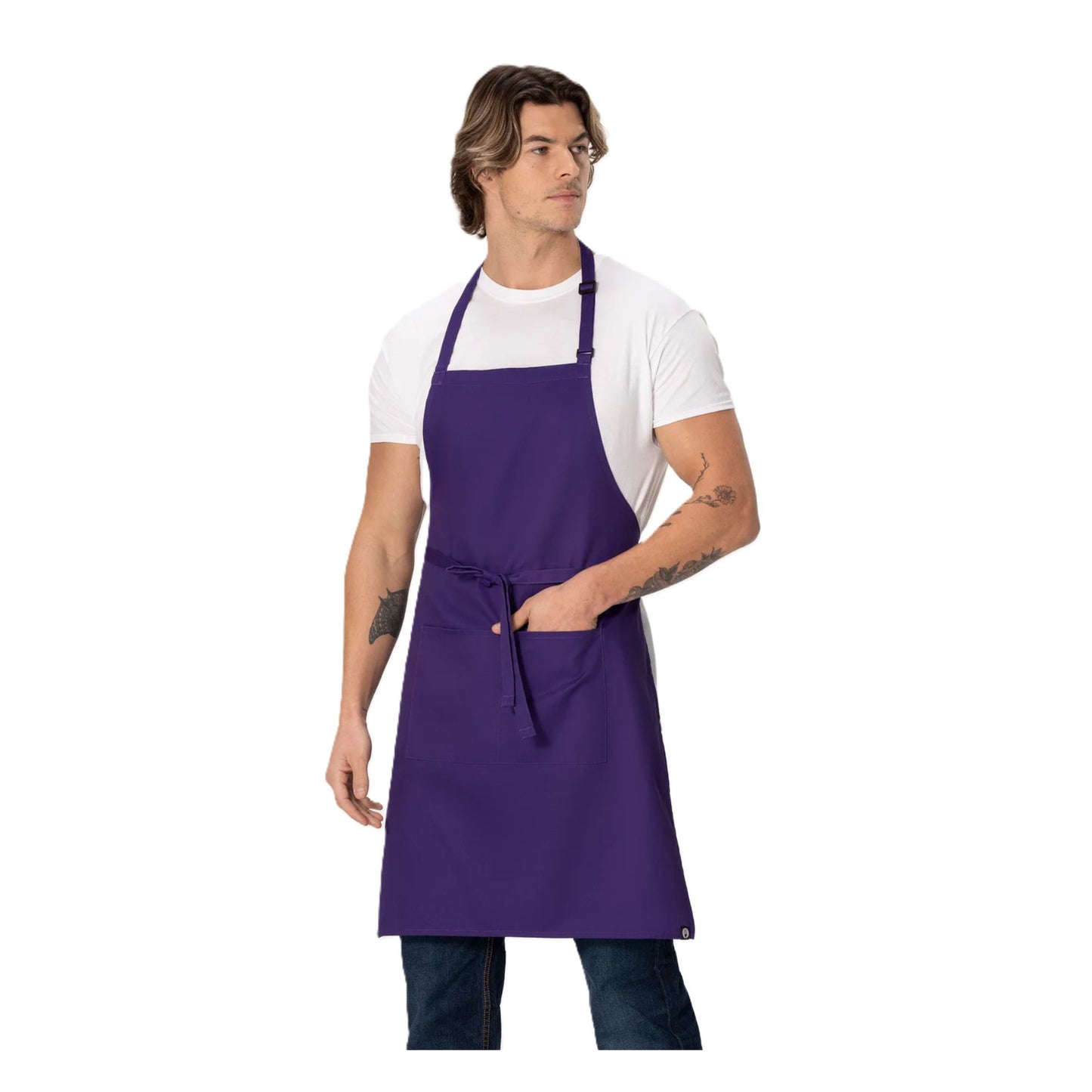 Front view of man with tattoos looking left wearing the Chef Works F8 Bib Apron with Pockets