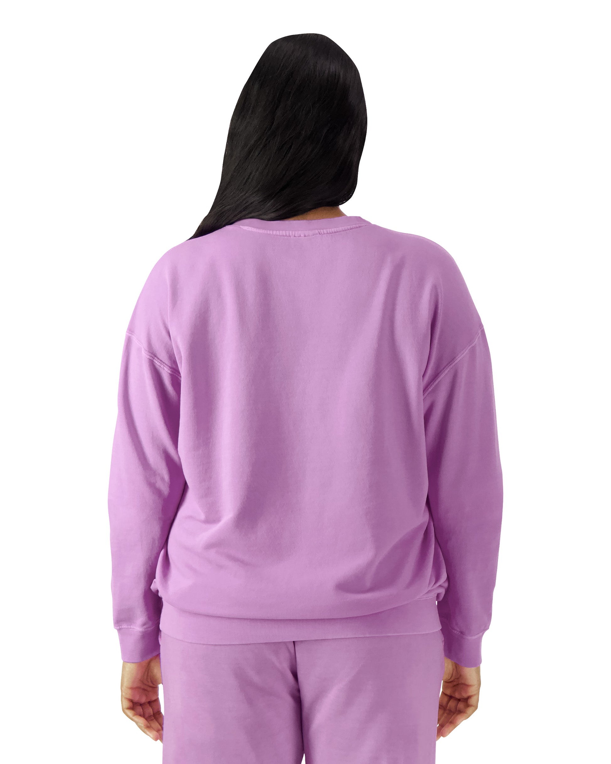 Back view of woman wearing neon violet coloured Comfort Colors Lightweight Sweatshirt with long hair over left shoulder