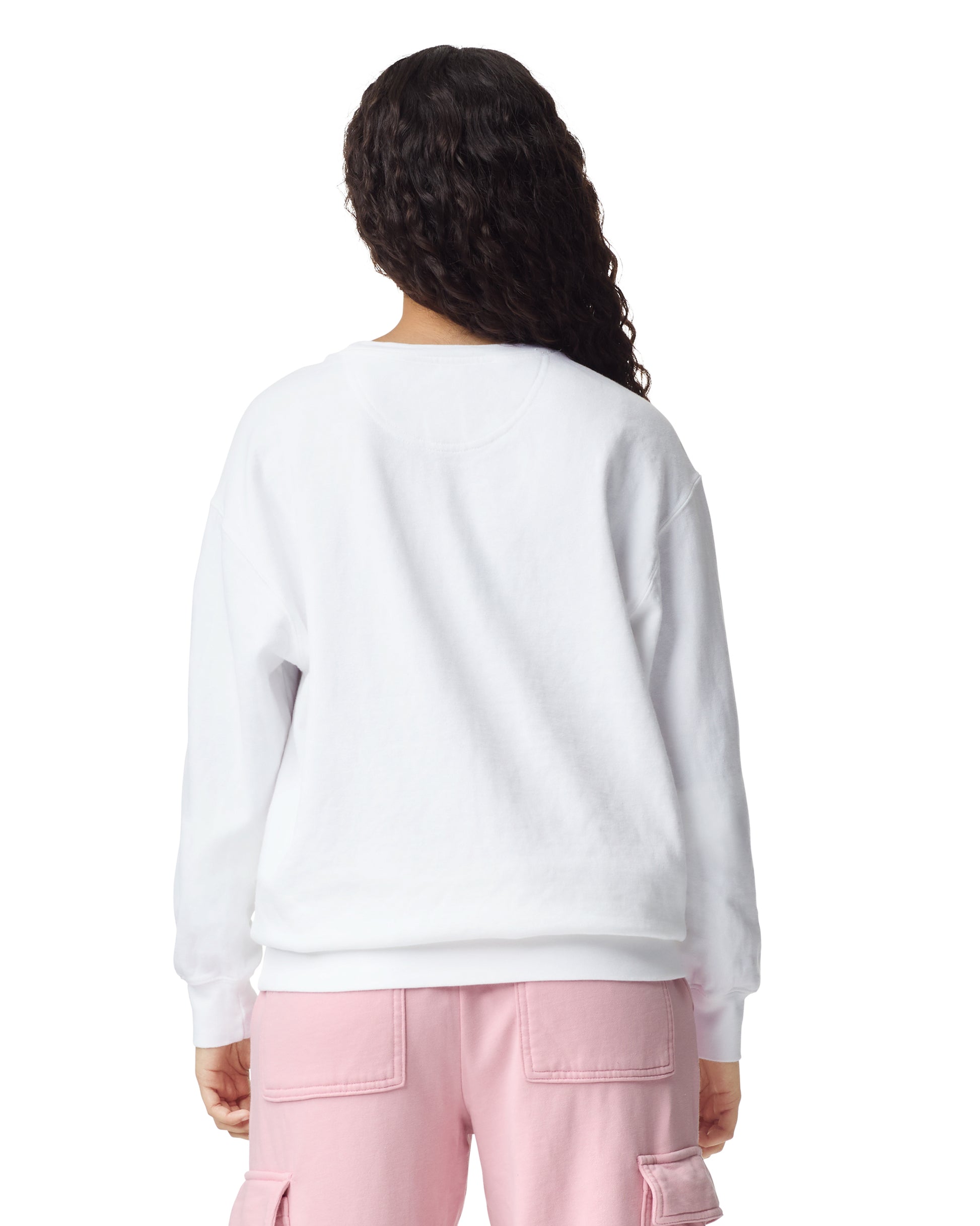 Back view of woman wearing unisex white Comfort Colors Crewneck Sweatshirt with long hair draped over right shoulder