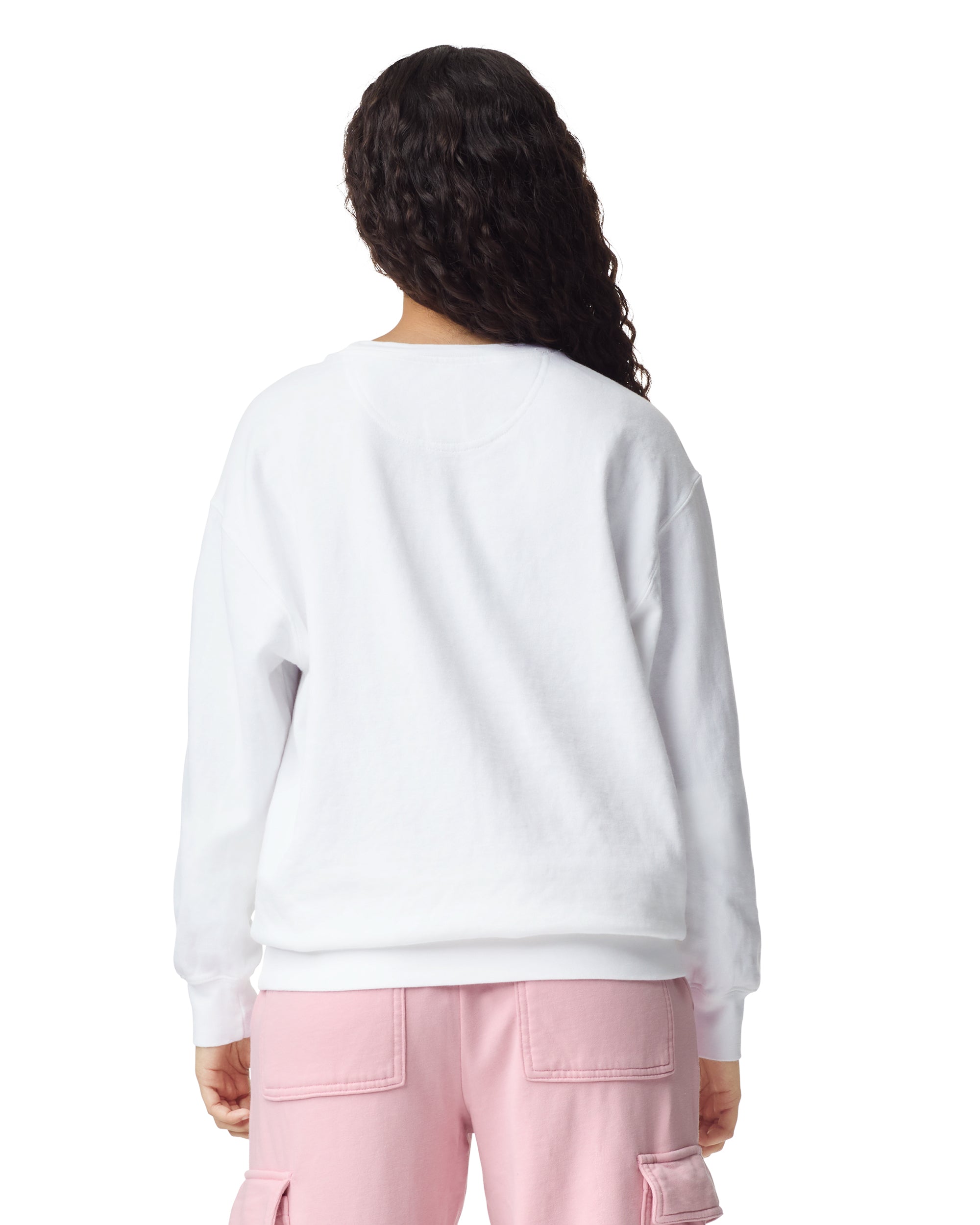 Back view of woman wearing unisex white Comfort Colors Crewneck Sweatshirt with long hair draped over right shoulder