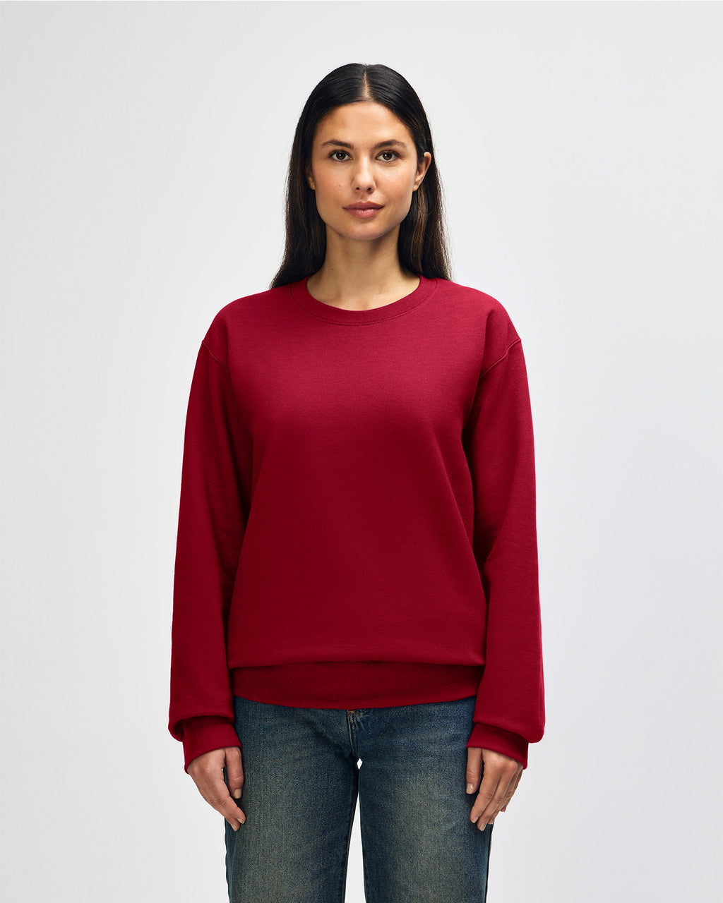Front view of woman wearing cherry red Gildan Hammer Maxweight Adult Sweatshirt looking straight ahead