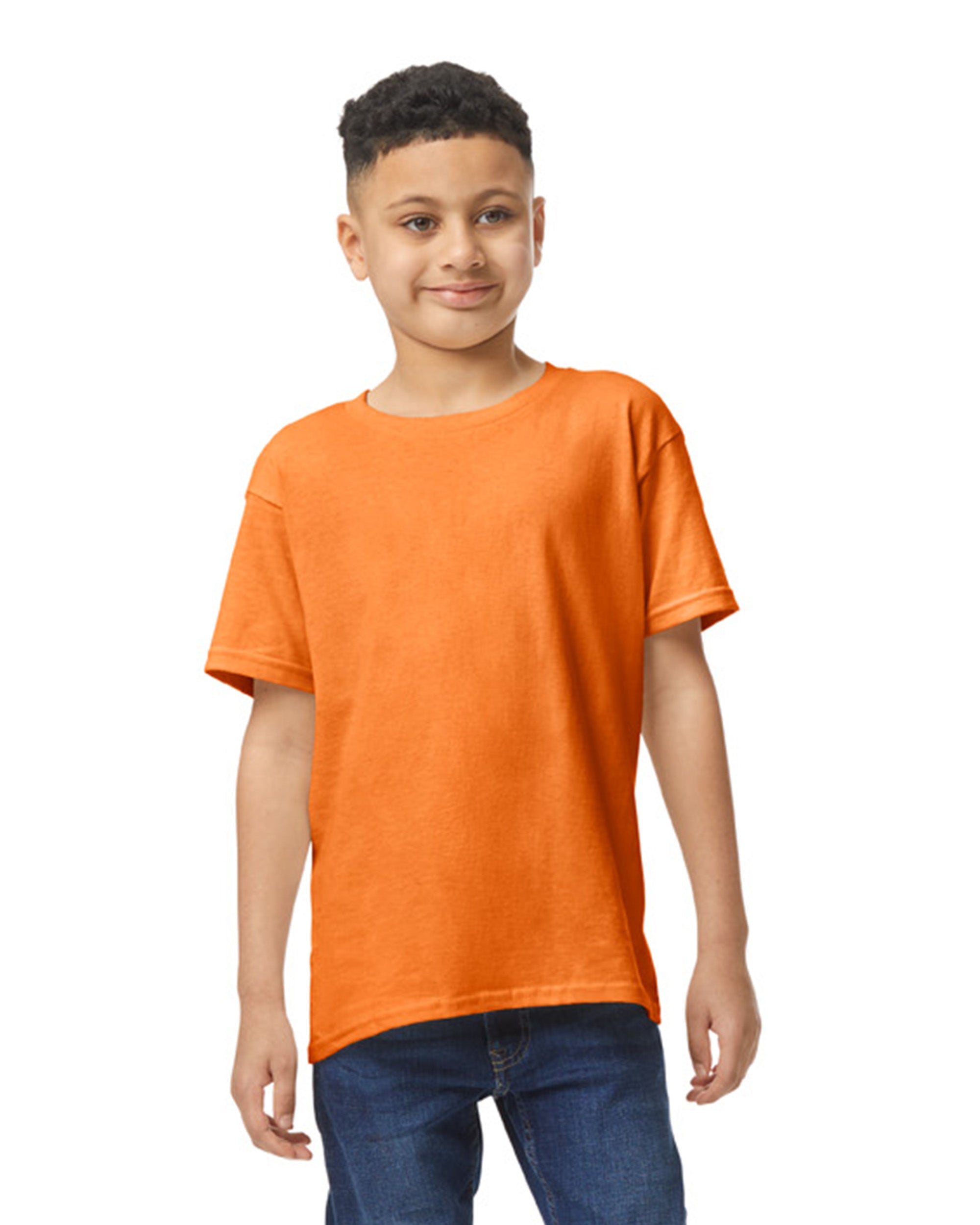 Front view of youth wearing safety orange Gildan 5000B Heavy Cotton Youth T-Shirt looking slightly left
