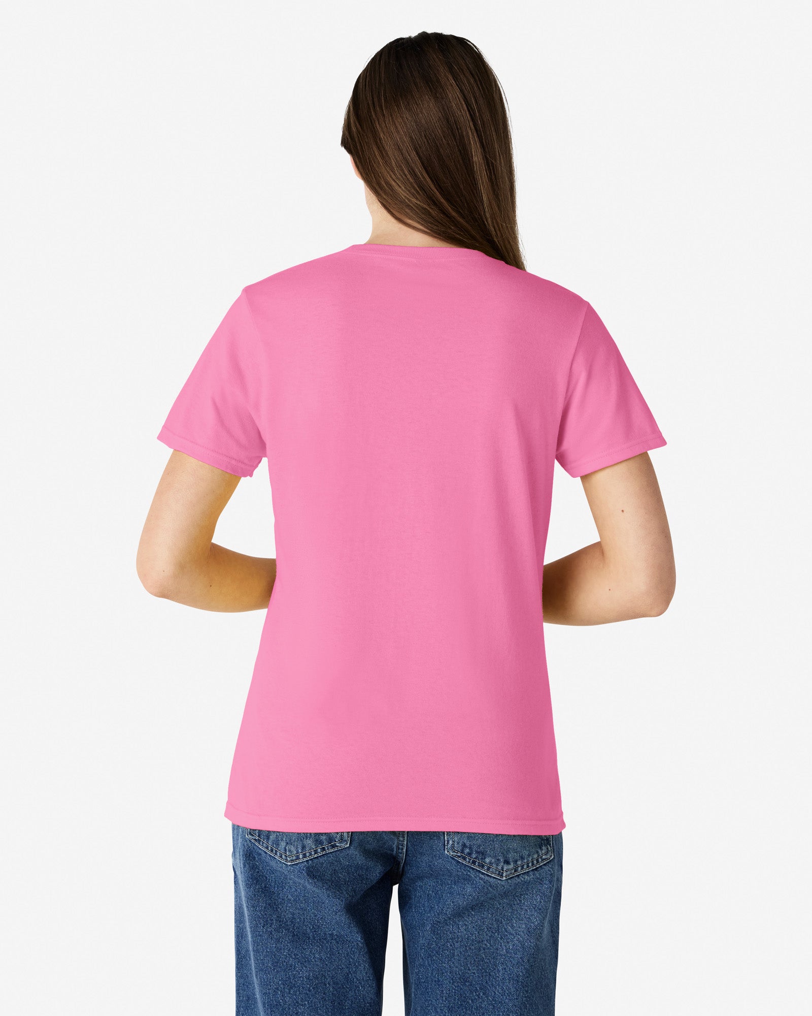 Back view of woman wearing azalea coloured Gildan 5000L Womens T-Shirt with hair over right shoulder and hands in front