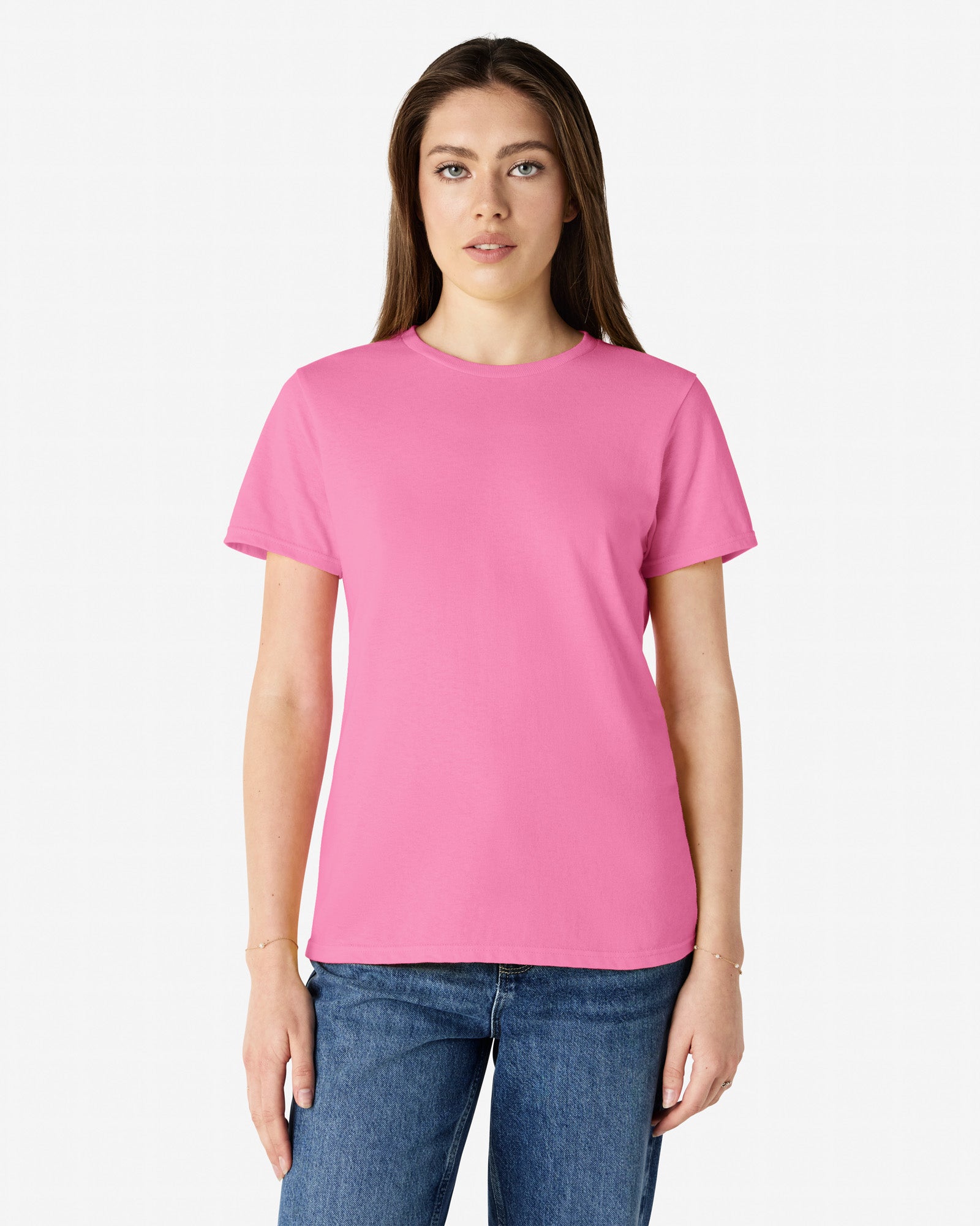 Front view of woman wearing azalea coloured Gildan 5000L Womens T-Shirt looking directly at camera