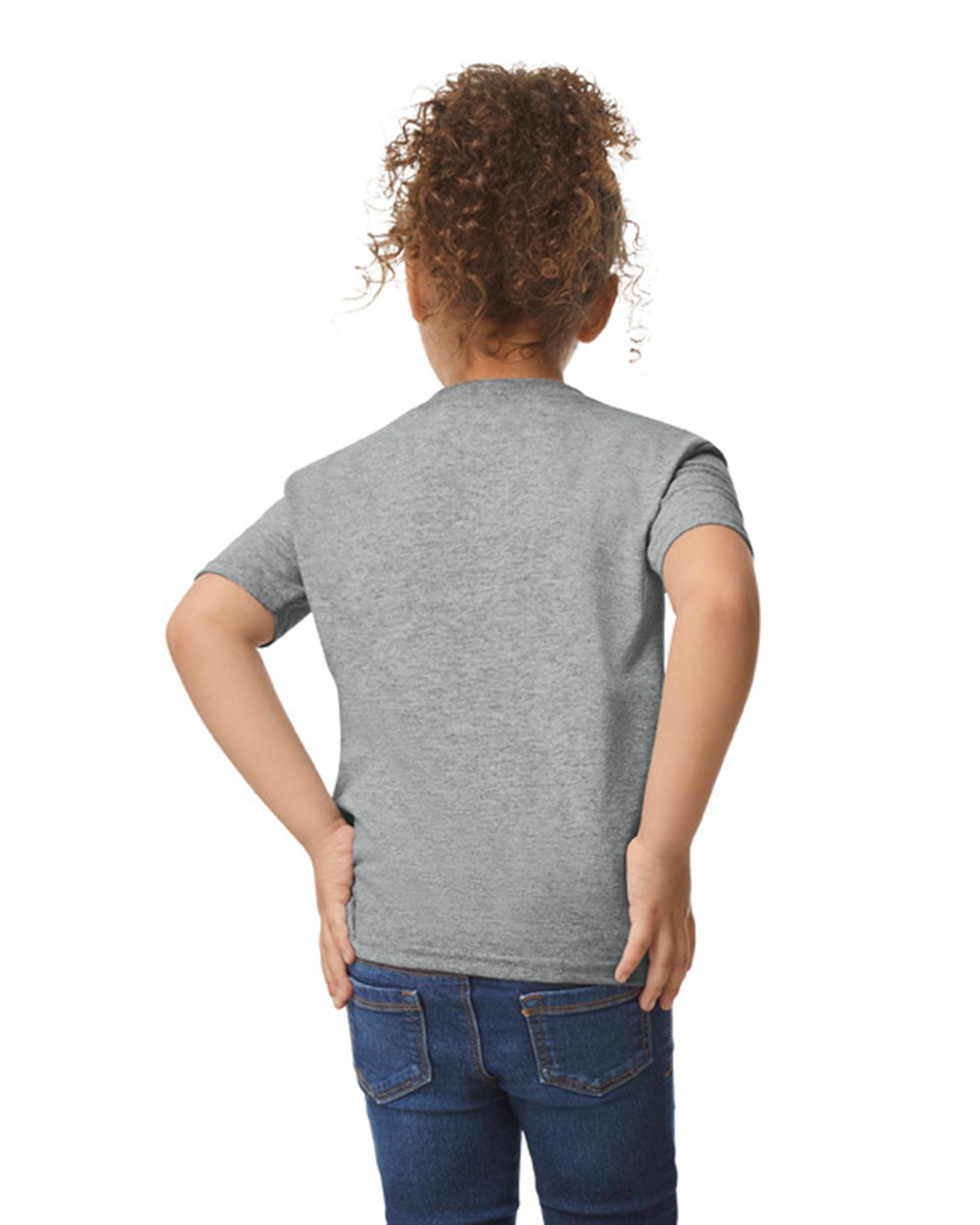Back view of child wearing grey Gildan 5100P Heavy Cotton Childrens T-Shirt with hands placed on hips