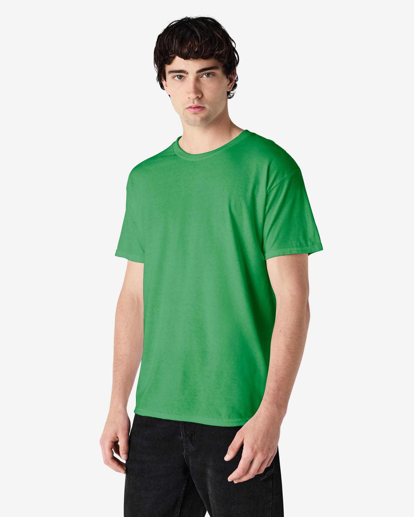 Front view of man wearing antique irish green Gildan Adult Heavy Cotton T-Shirt standing slightly side on