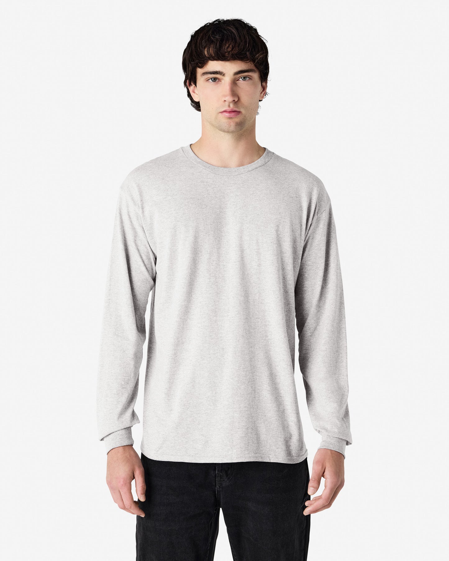 Front view of man wearing ash grey Gildan Adult 5400 Long Sleeve Heavy Cotton T-Shirt looking straight ahead