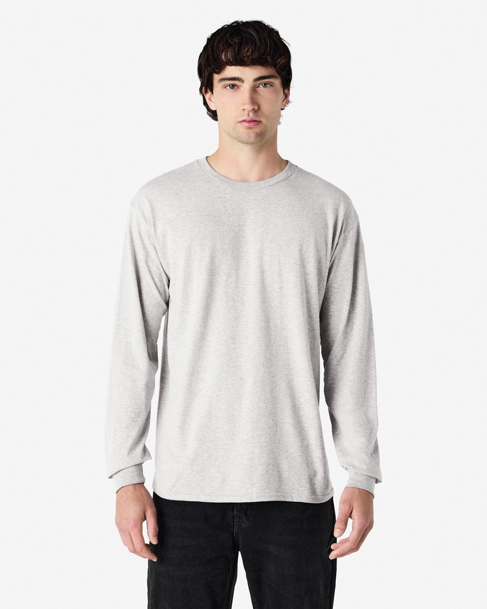 Front view of man wearing ash grey Gildan Adult 5400 Long Sleeve Heavy Cotton T-Shirt looking straight ahead