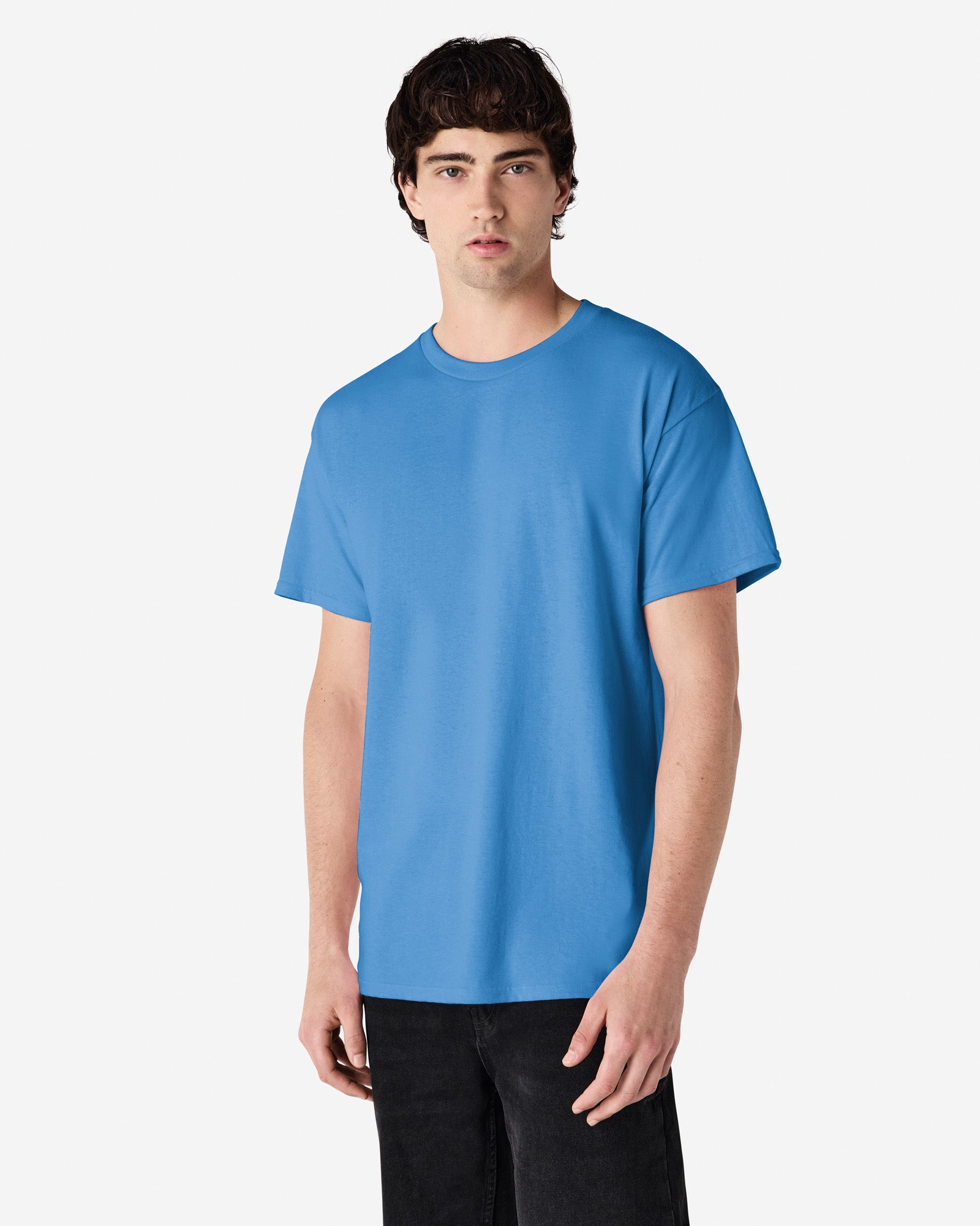 Front view of man wearing iris coloured Gildan Adult Ultra Cotton T-Shirt standing slightly side on looking at the camera
