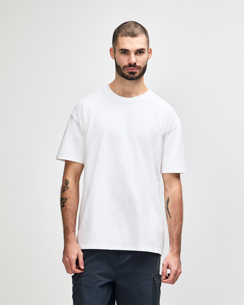 Front view of bearded man wearing white Gildan Hammer 7500 Adult Oversize Maxweight T-Shirt
