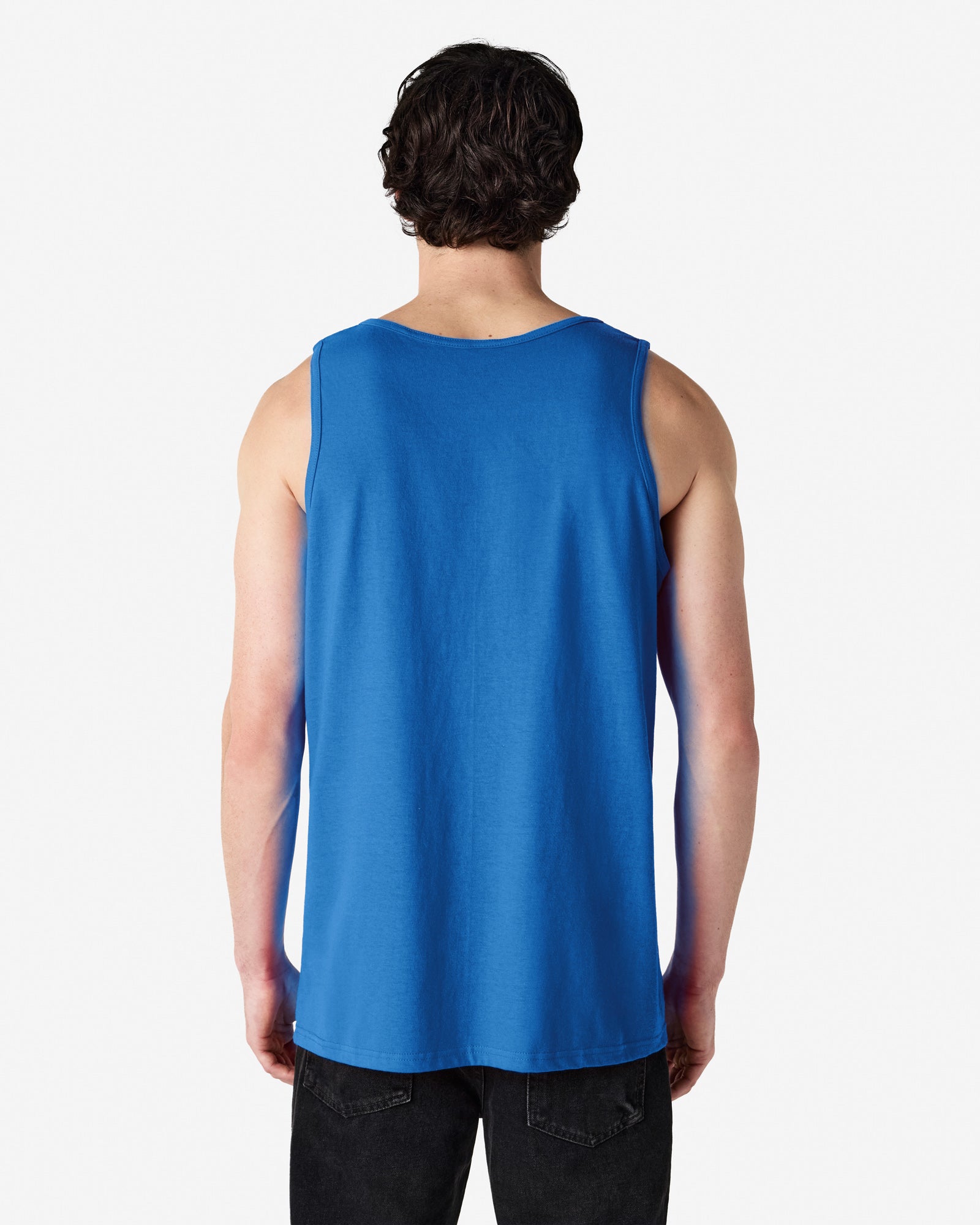 Back view of man wearing royal coloured Gildan Heavy Adult Tank Top with hands along side