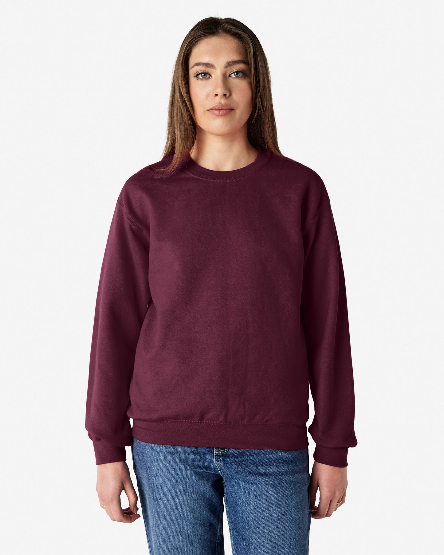 Front view of woman wearing maroon unisex Gildan Heavy Blend Adult Sweatshirt looking straight ahead