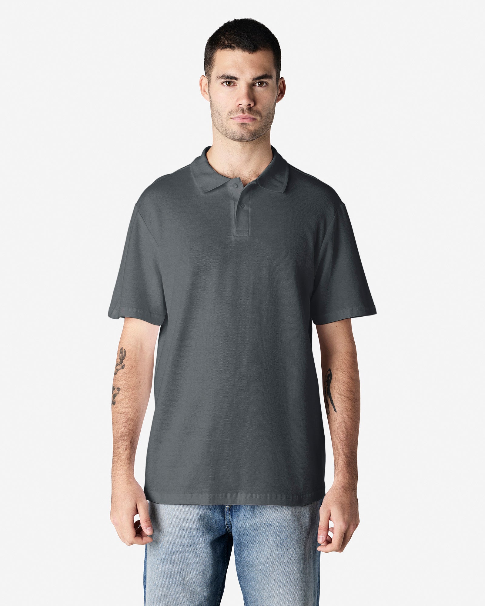 Front view of man wearing a grey Gildan Softstyle 64800 Mens Polo Shirt looking straight ahead