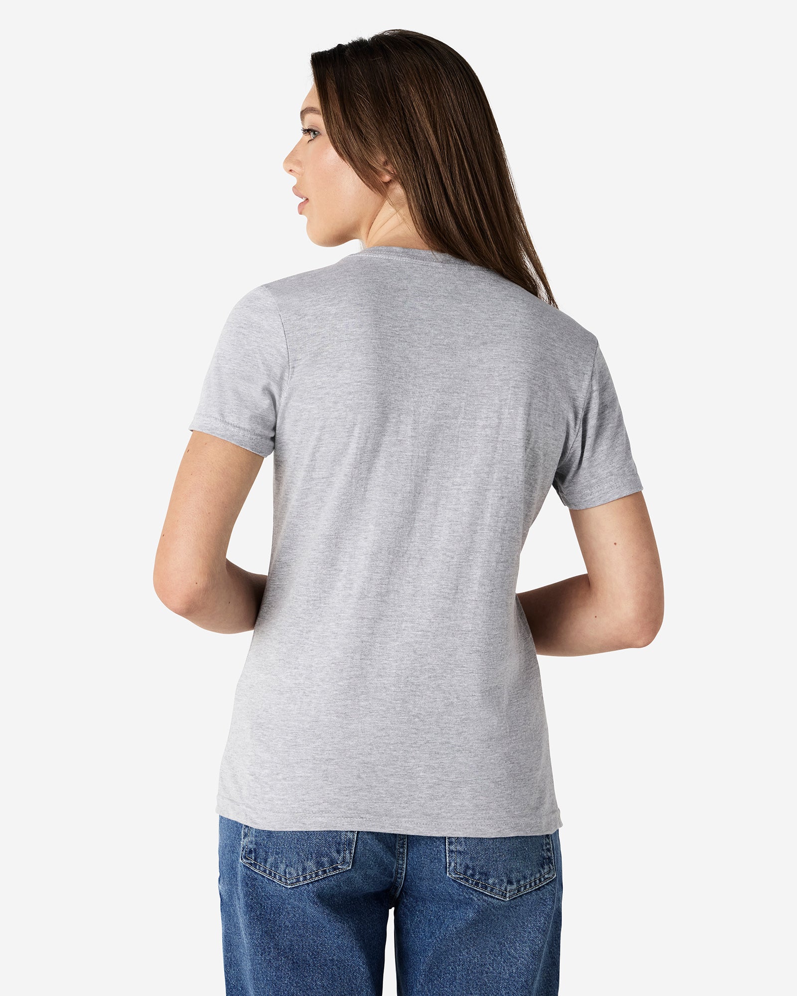 Back view of woman wearing grey Gildan Softstyle Womens V-Neck T-Shirt looking left